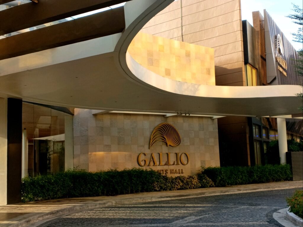 Exterior view of Gallio Events Hall, showing its entrance, signage, and modern architectural details in daylight.